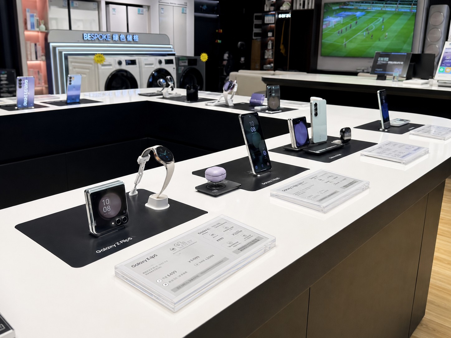 Samsung mobile display table with smartphones, wearables, labels and security holders