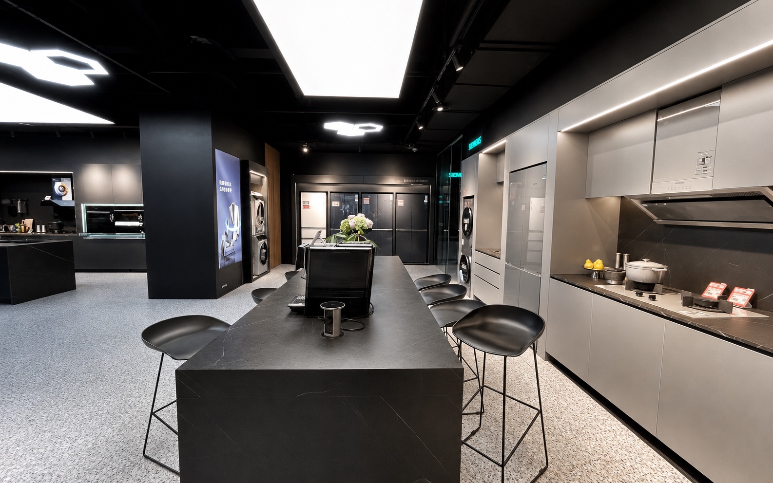 Siemens appliance experience area with product displays, lighting and brand communication
