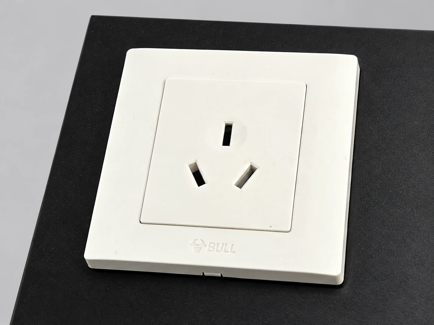 Close view of the socket mounted on the sloped display board