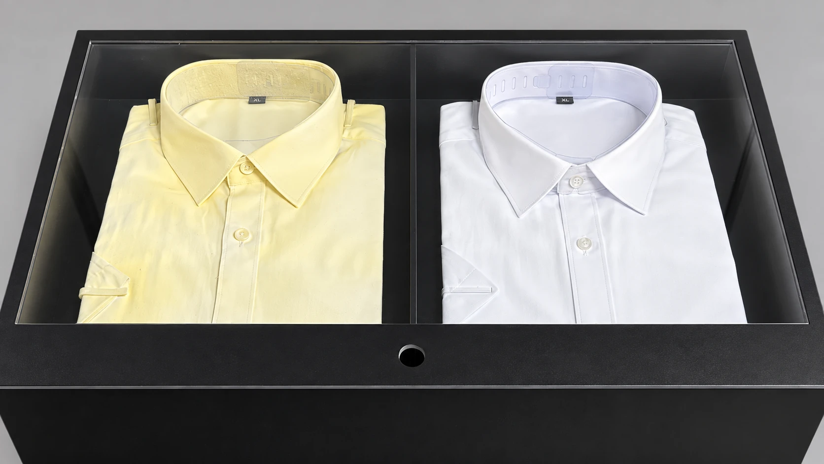 Close view of the two shirt samples and central divider