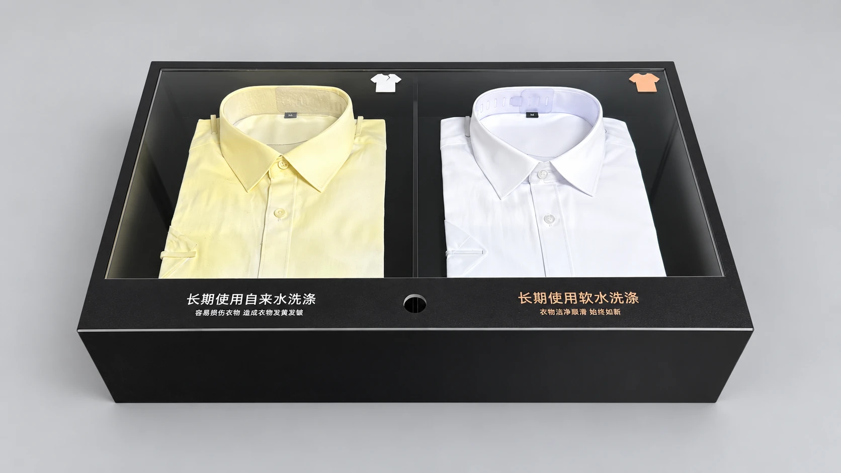 Two differently coloured folded shirts in a divided black display box