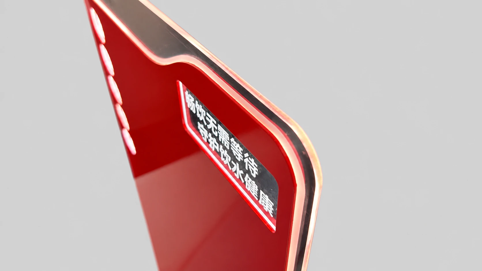 Illuminated outline along the curved edge of the ANGEL backboard