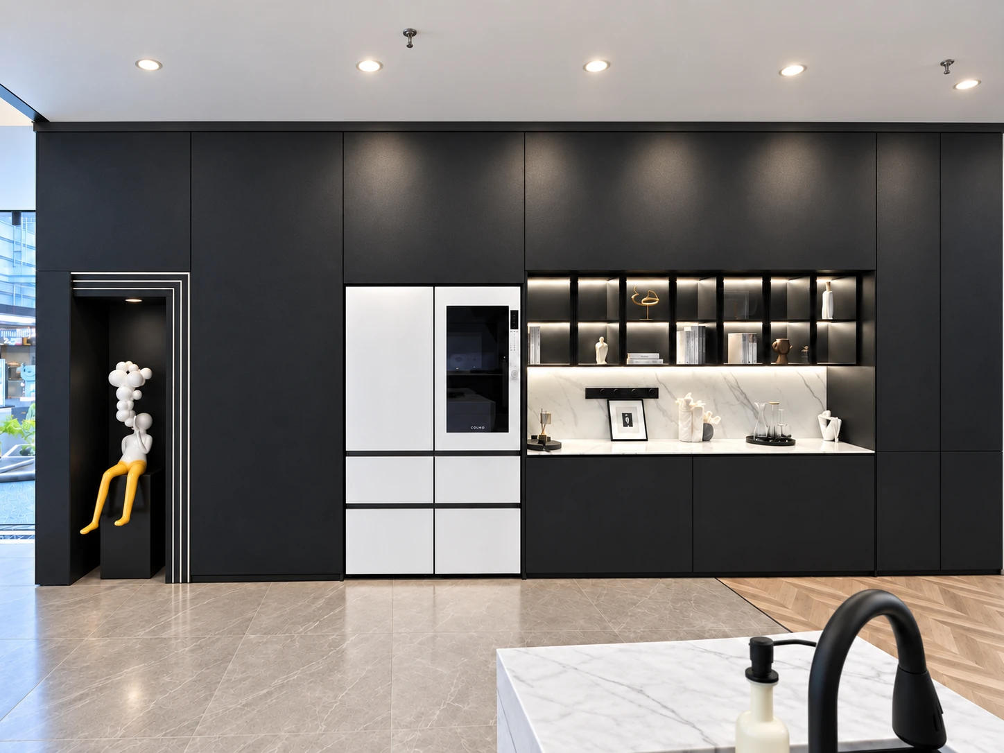 Dark appliance wall with refrigerator and illuminated display niches